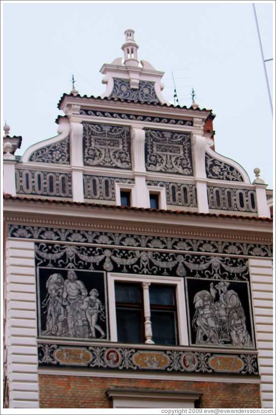 Building with intricate white designs on a black background, corner of Sko&#345;epka and Na Per?t?n&#283;, Star?&#283;sto.