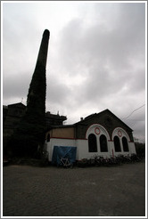 Building and leaning chimney.