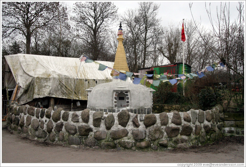 Structure with stone wall.