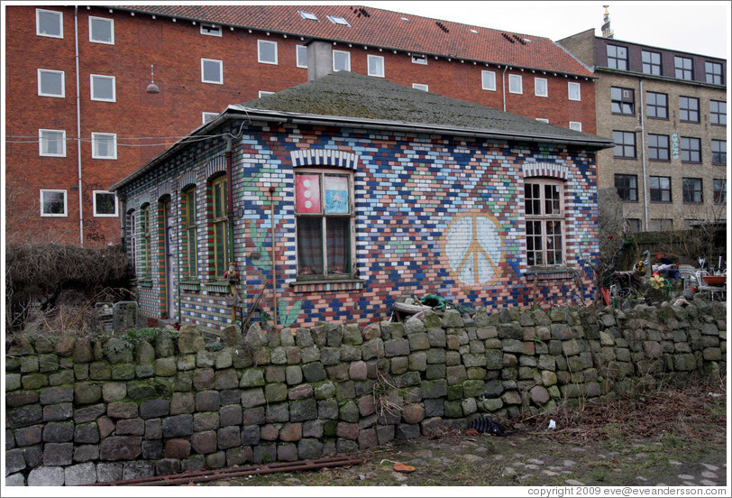 House with tiled walls.  Pattern includes a peace sign.