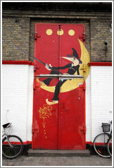 Door of the Moonfisher Cafe, with the three dots symbolizing Christiania at the top.