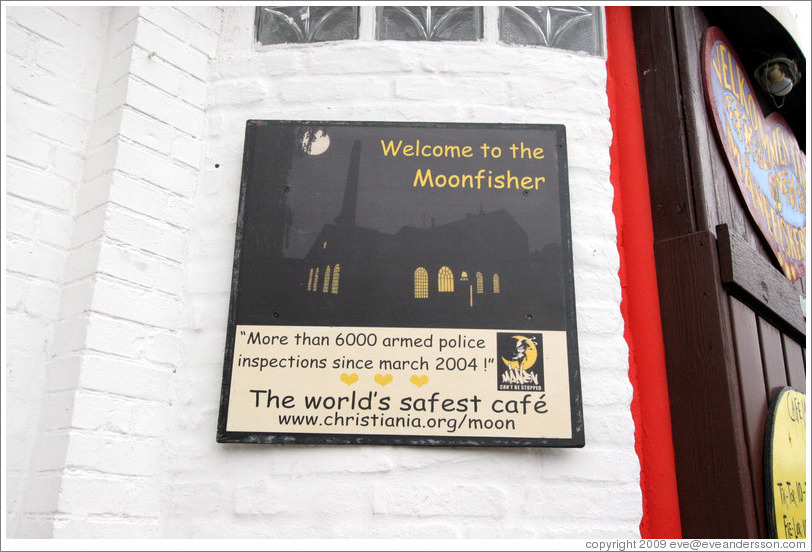 Sign: Welcome to the Moonfisher; More than 6000 armed police inspections since 2004; The world's safest cafe.