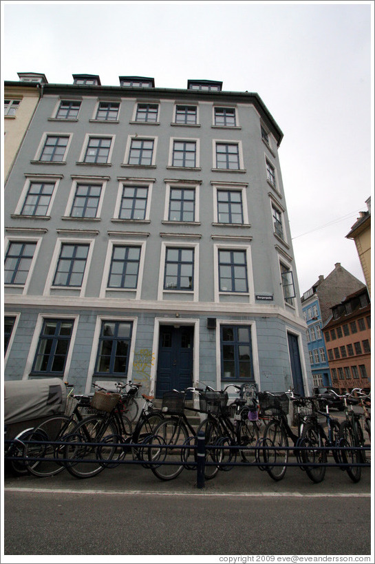 Grey house with bicycles.  Borgergade, city centre.