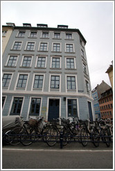 Grey house with bicycles.  Borgergade, city centre.