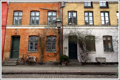 Brick houses, orange, yellow, and off-white.  Neighborhood near Sankt Pauls Kirke, city centre.