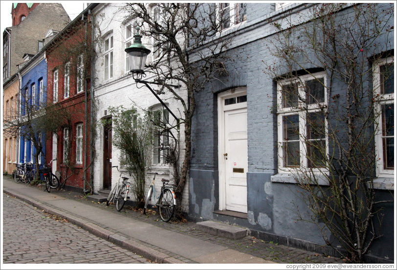 Row of houses: yellow, blue, brown, white, and grey.  Near Sankt Pauls Kirke, city centre.