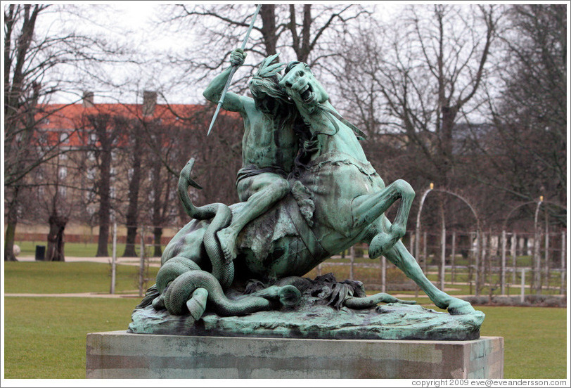 Kamp med en slange, a statue by Thomas Brock.  Portrays a Native American attempting to spear a snake that has wrapped itself around his horse.  Kongens Have (King's Gardens).