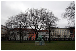 Kongens Have (King's Gardens).  In the distance is Kamp med en slange, a statue by Thomas Brock.  Portrays a Native American attempting to spear a snake that has wrapped itself around his horse.
