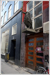 Bird sculpture covered with bird droppings.  Klareboderne, city centre.