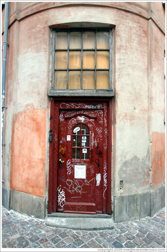 Heavily graffitied door of Faraos Cigarer.  Klosterstr?, city centre.