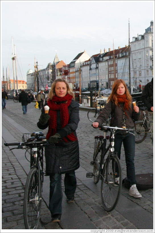Girls with ice cream cones and bicycles.  Nyhavn (New Harbor).
