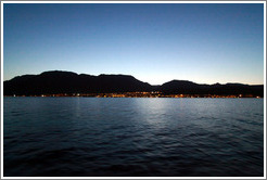 Taba Heights in front of mountains at dusk.