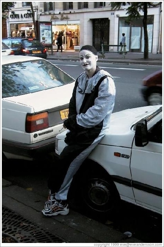 Smoking clown who bopped Eve on the head after posing for a photograph.