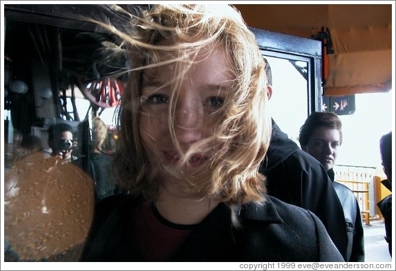 Eve, windblown, Eiffel Tower.