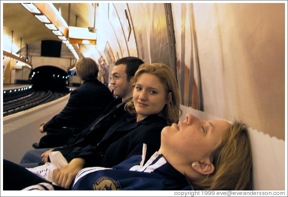 Tracy sleeping while waiting for the Paris metro.