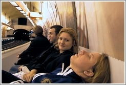 Tracy sleeping while waiting for the Paris metro.