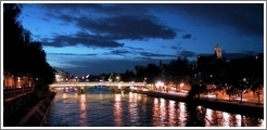 A bridge over the Seine at night.
