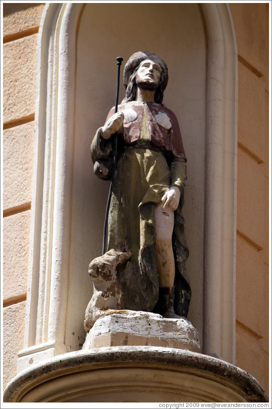 Oratory on a building at the intersection of Rue Cardinale and Rue d'Italie.  Depicts a man, possibly with a hare. Quartier Mazarin.