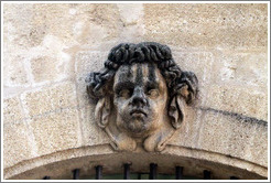 Sculpture of a man's face adorning the facade of the Halle aux Grains (the former Grain Exchange, 1759-61).  Place de l'H? de Ville (city hall plaza).