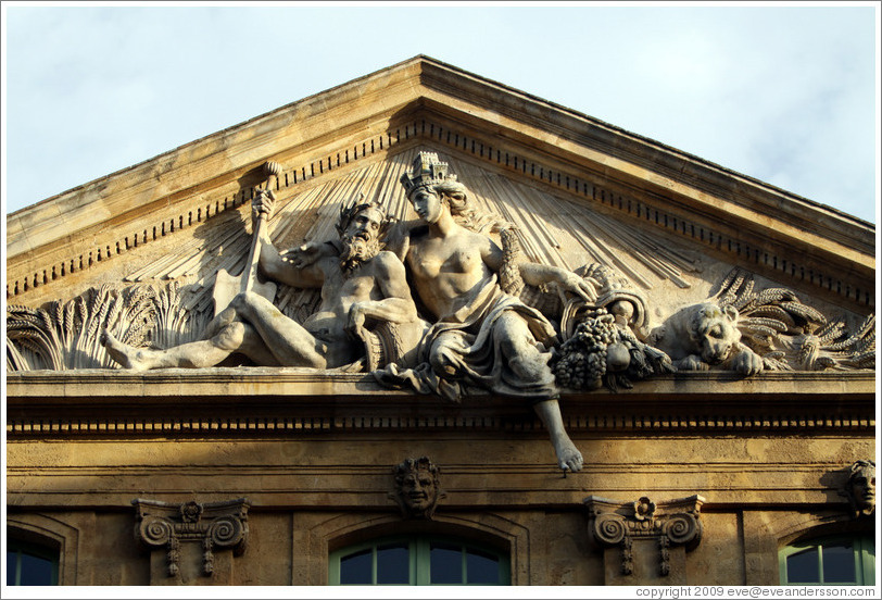 Figures representing the Rhone and Durance rivers.  Halle aux Grains (the former Grain Exchange, 1759-61).  Place de l'H? de Ville (city hall plaza).