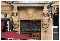 Male and female telamones supporting a balcony.  Place des Pr?eurs.  Old town.