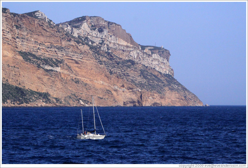 Sailboat in front of the calanques of Marseilles, viewed from Cassis.