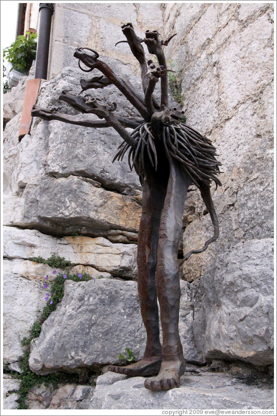 Sculpture that looks like a combination of dragons/bulls/snakes/emu/human.