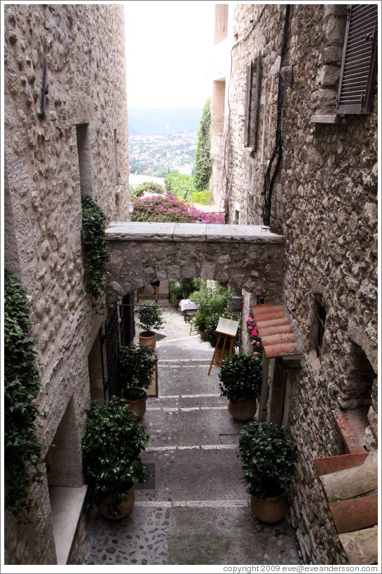 Village center.  Looking on a street with an arch.