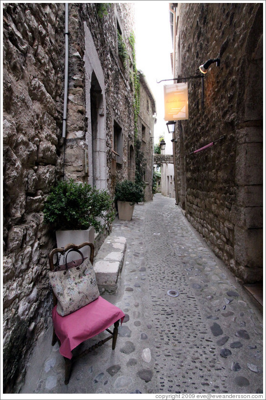 Chair with a handbag, inexplicably on the street.