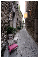 Chair with a handbag, inexplicably on the street.