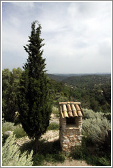 Stone structure and tree outside the town center.