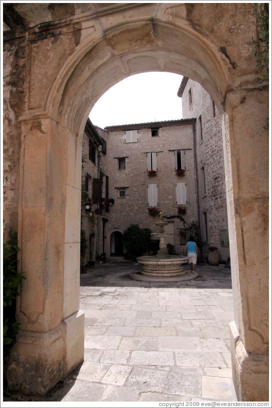 Arch with a fountain behind.