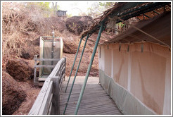 Shower at the side of a safari tent.