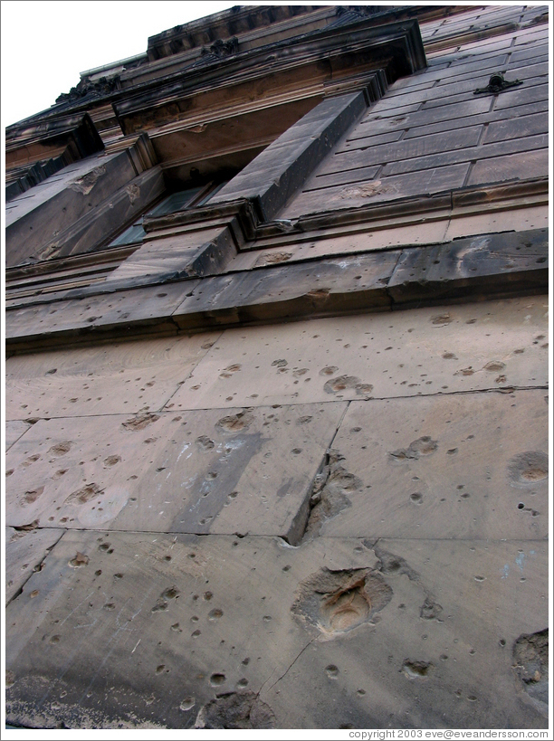 Bullet holes, remaining from WWII.