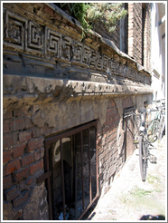 Bullet holes, remaining from WWII.