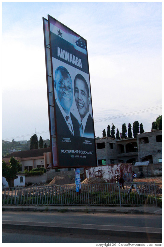 Billboard reading Akwaaba / Partnership for Change, with photos of the president of Ghana, John Atta Mills, and the president of the United States, Barack Obama.