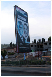 Billboard reading Akwaaba / Partnership for Change, with photos of the president of Ghana, John Atta Mills, and the president of the United States, Barack Obama.