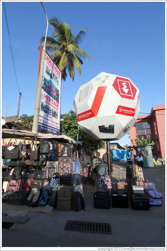 Polyhedron and a sign advertising Chinese and Indian restaurants, Cantonments Road, Osu district.