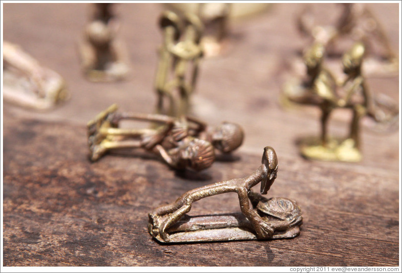 Bronze figures copulating. Centre For National Culture textiles market.