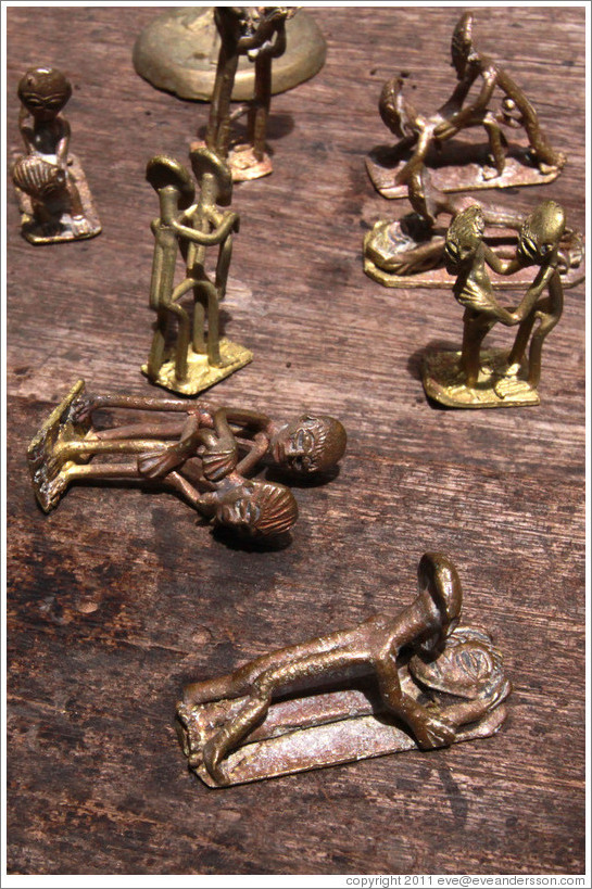 Bronze figures copulating. Centre For National Culture textiles market.