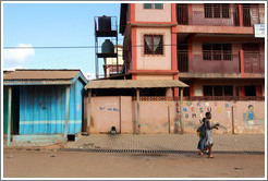 Two girls walking down the street.