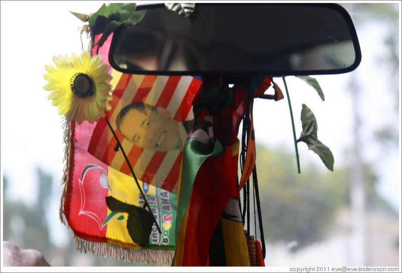 Barack Obama on an American flag, hanging from a taxi driver's rear view mirror.