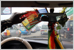 Barack Obama on an American flag, hanging from a taxi driver's rear view mirror.