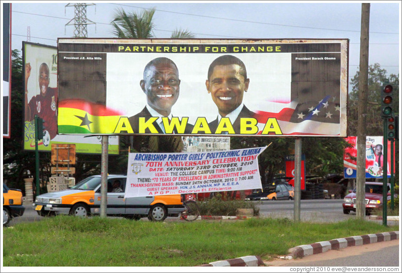 Billboard reading Partnership for Change / Akwaaba, with photos of the president of Ghana, John Atta Mills, and the president of the United States, Barack Obama.