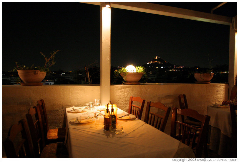 &#917;&#955;&#945;&#953;&#945; restaurant.  Rooftop dining area at night.