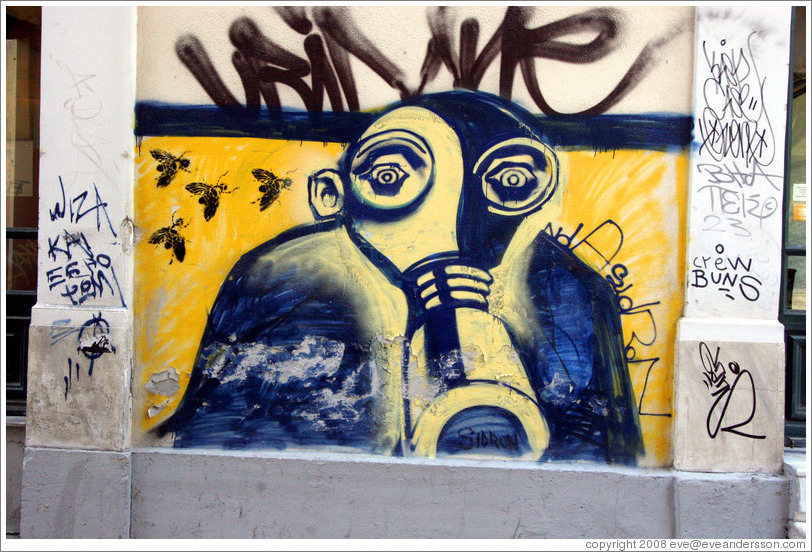 Graffiti depicting a man wearing a gas mask.