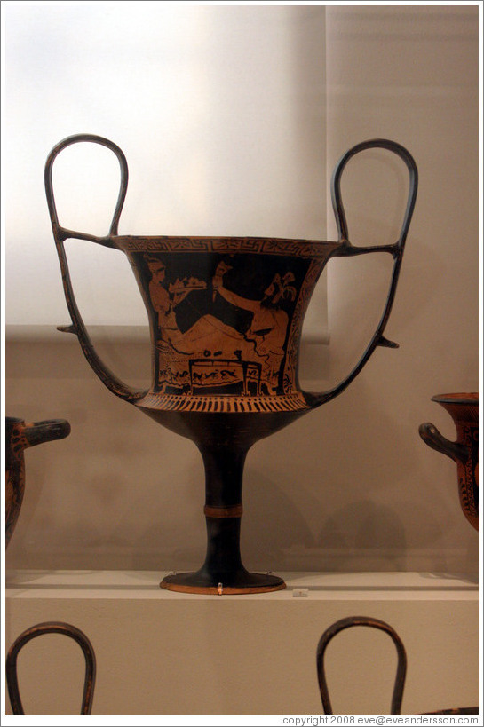 Red figure kantharos depicting a female bringing an offering to the god Kabeiros, from 420 BC.  National Archaeological Museum.