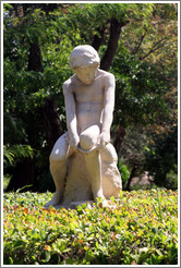 Statue of a boy.  National Gardens.