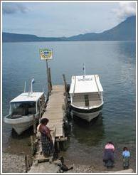 Mother and daughters by boats, Panajachel.