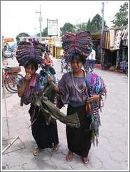 Girls balancing cloths on their heads, Panajachel.